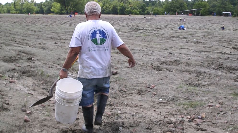 PHOTO: Local digger Al Fling carries a bucket into the digging grounds of Crater of Diamonds State Park in Murfreesboro, Ark.