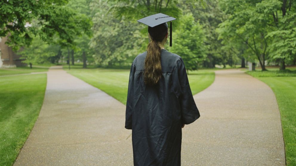 A graduate takes a walk in this undated file photo.