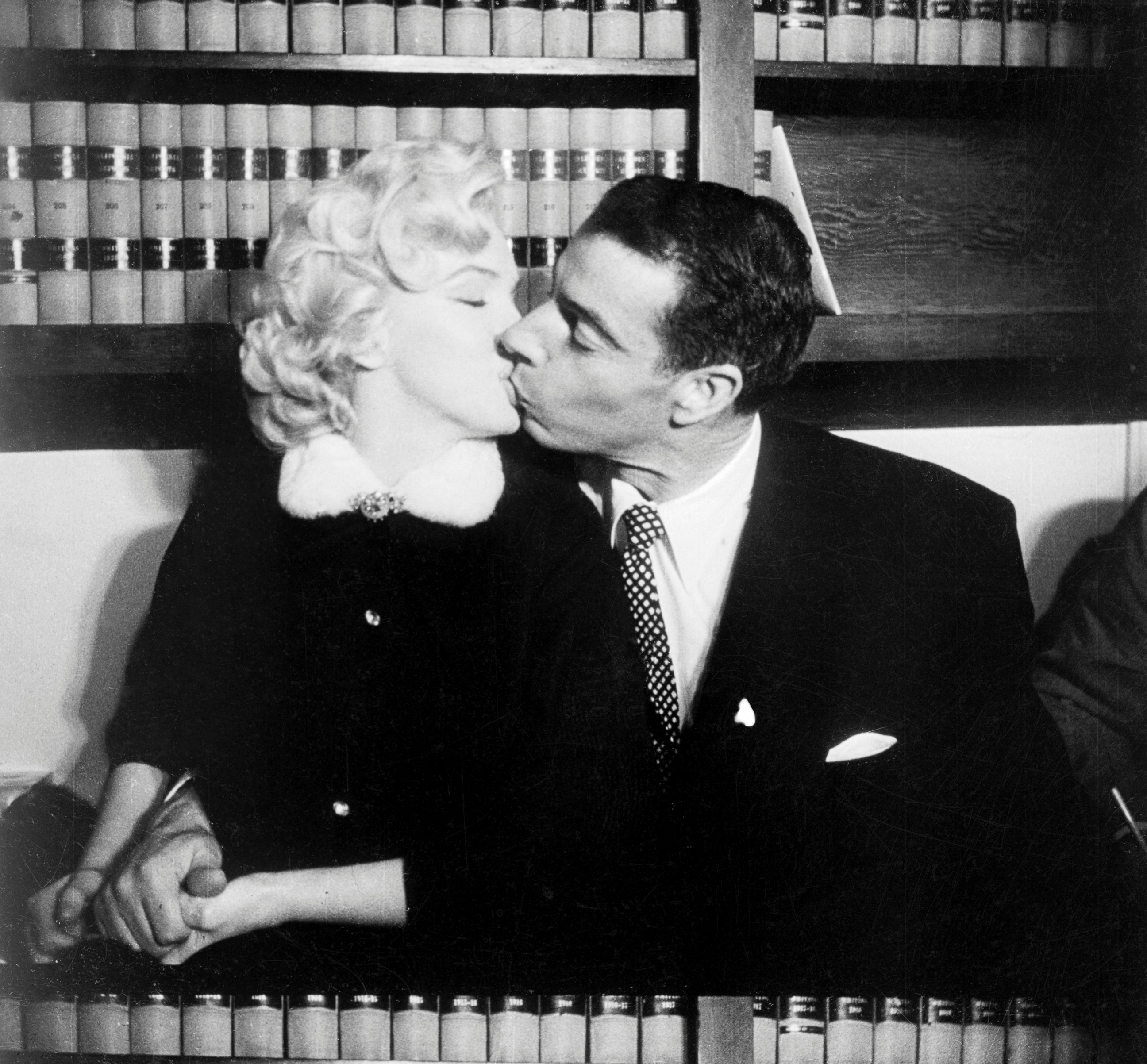 PHOTO: Marilyn Monroe and Joe DiMaggio kiss in the judge's chambers where they were married, Jan. 14, 1954.