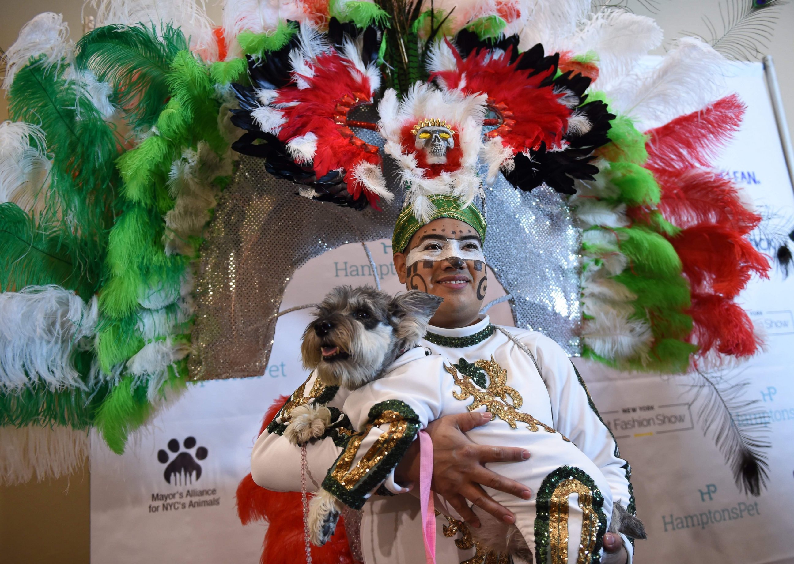 PHOTO: Miguel Garcia with his dog dressed in the fashion of Mexico posed during the 14th Annual New York Pet Fashion Show, Feb. 9, 2017.
