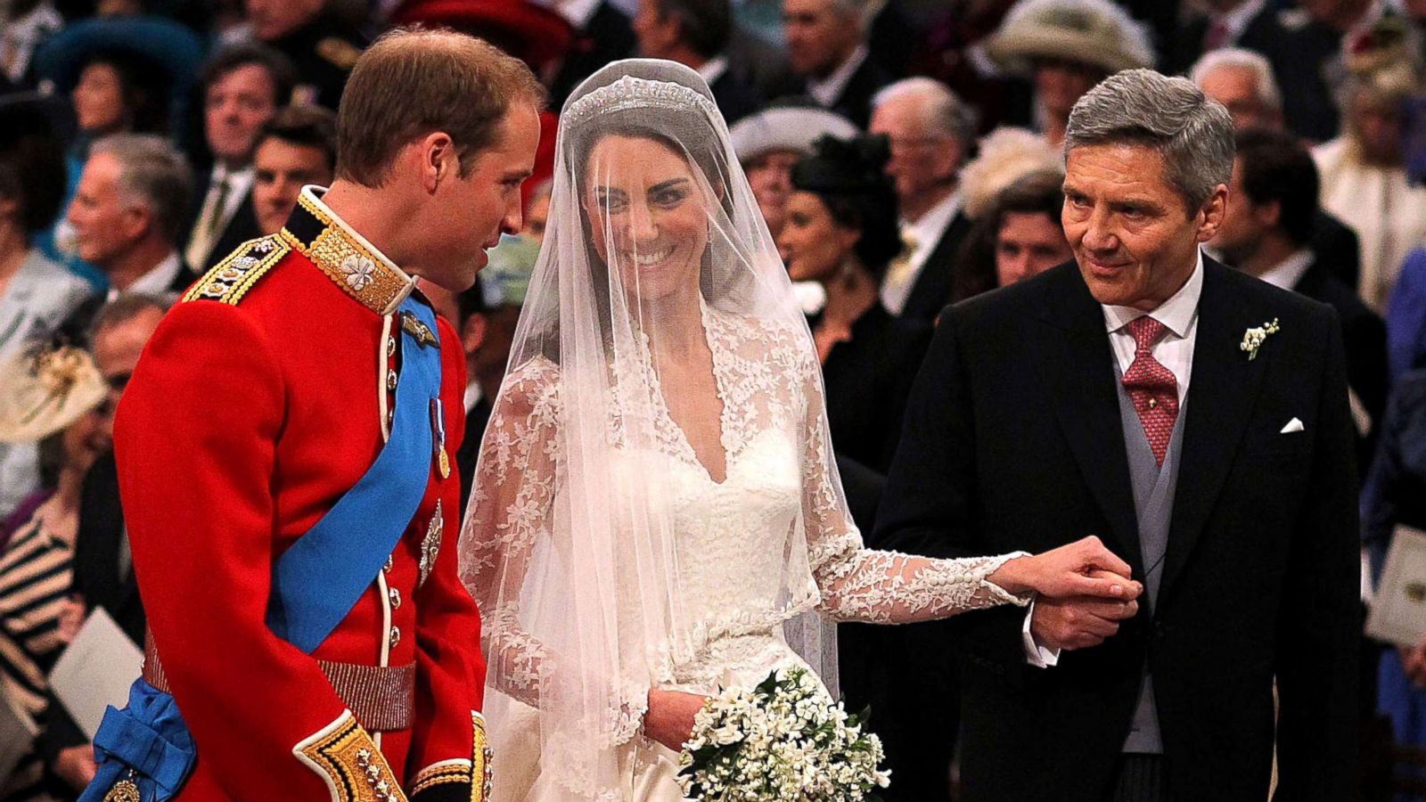 PHOTO:Prince William speaks to his bride, Catherine Middleton as she holds the hand of her father Michael Middleton at Westminster Abbey, April 29, 2011, in London.