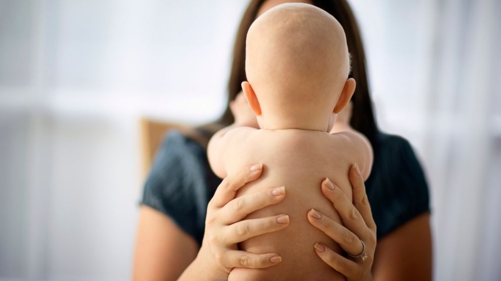 A mother holds her baby in this undated stock photo.