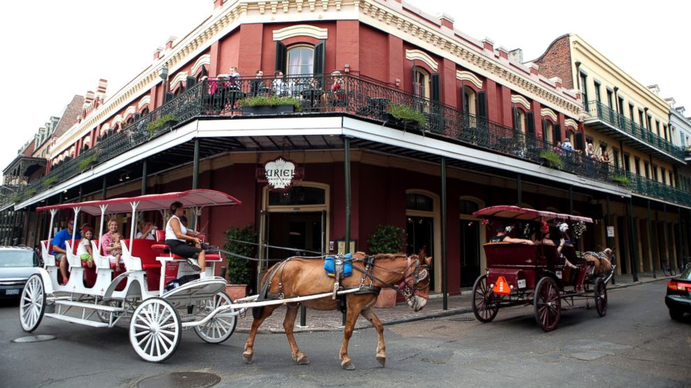 PHOTO: Mule-drawn carriages make their way through the French Quarter, July 24, 2010, in New Orleans.