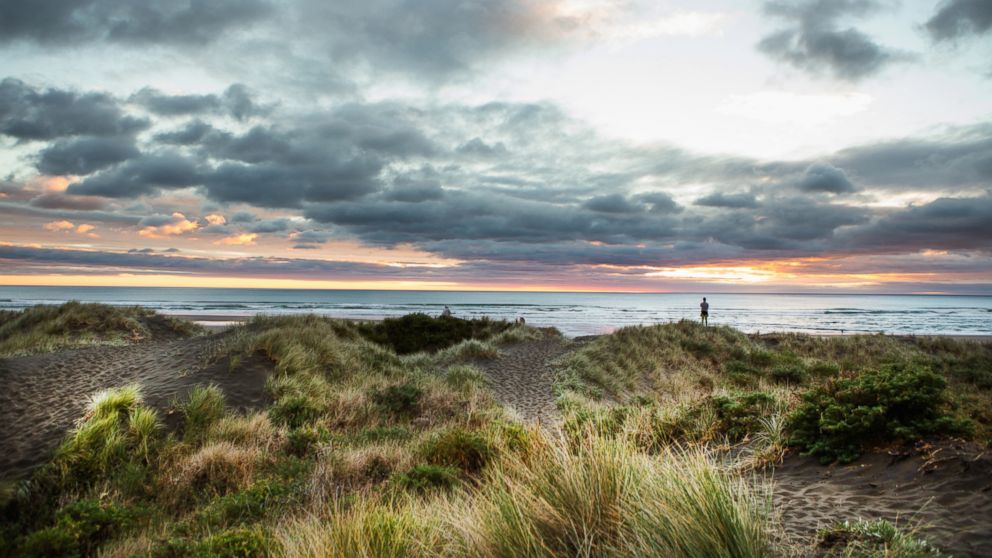 The sunset is pictured at the surf beach of Piha in Auckland, New Zealand.