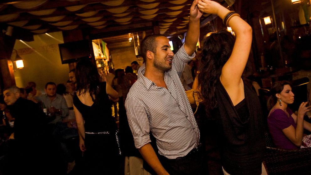 PHOTO: A Palestinian couple dance in the Orjuwan Lounge, June 24, 2010, in Ramallah, West Bank. 