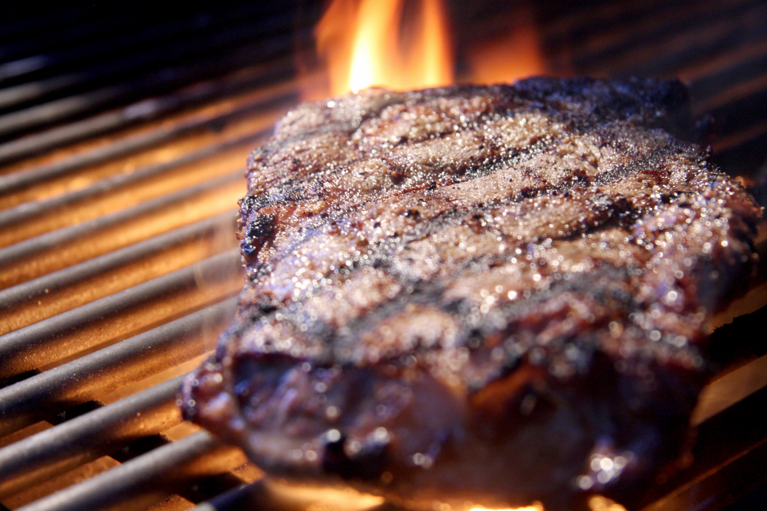PHOTO: Rib eye steak on a grill.