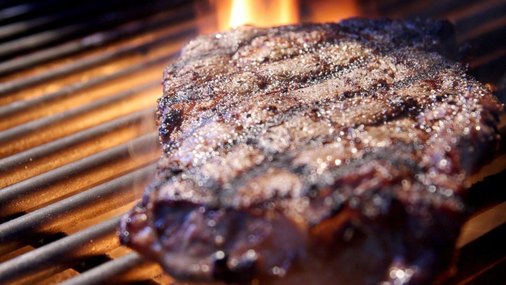 Rib eye steak on a grill.
