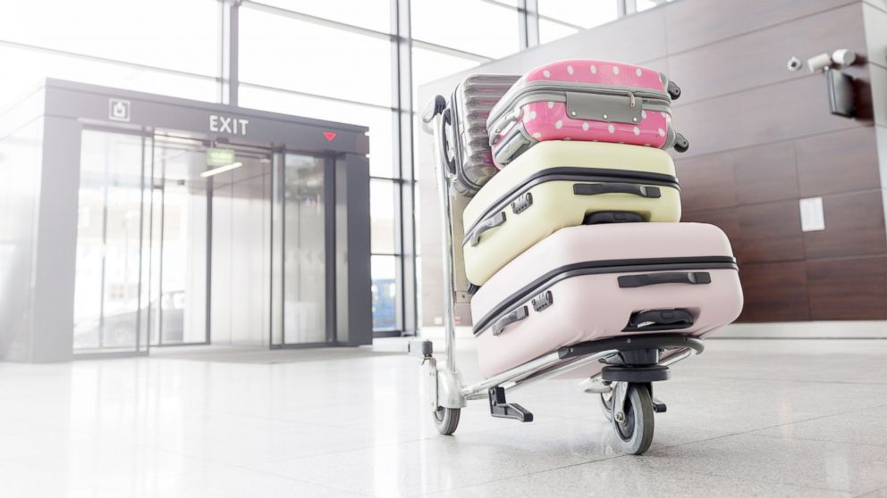 A baggage cart with suitcases at the airport is pictured in this undated stock photo.