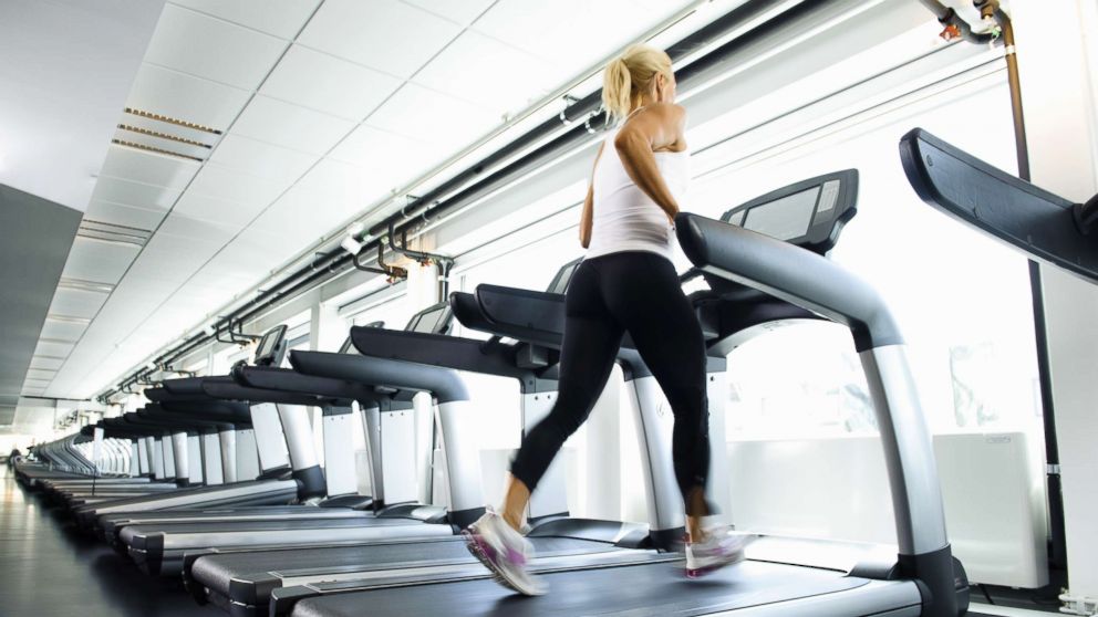 PHOTO: A woman works out on a treadmill.