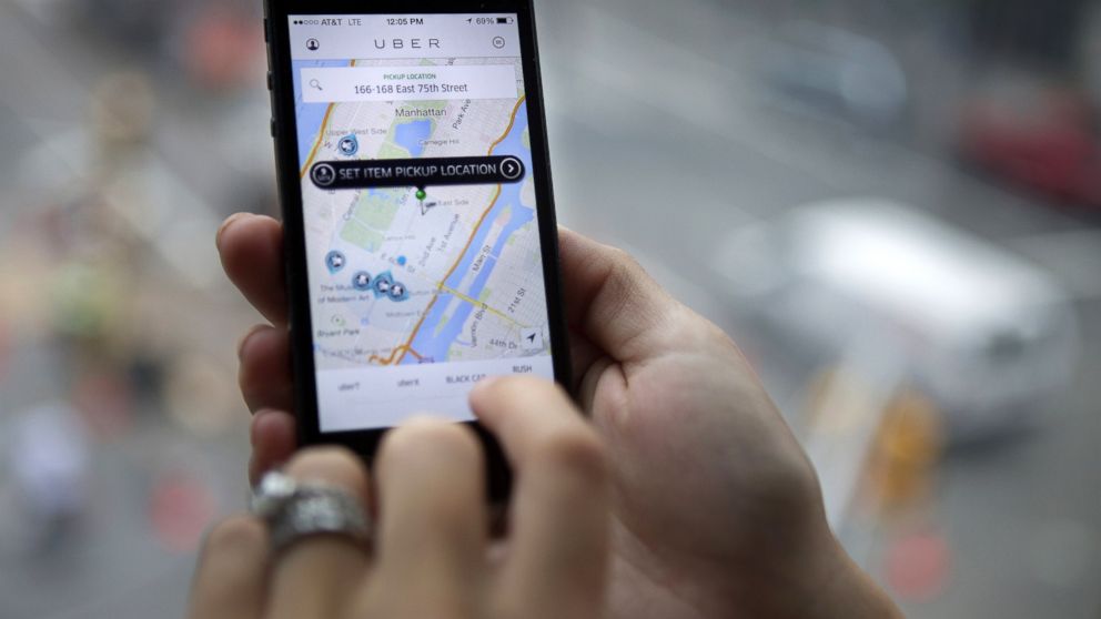 PHOTO: The Uber Technologies Inc. car service application is demonstrated for a photograph on an Apple Inc. iPhone in New York, Aug. 6, 2014.