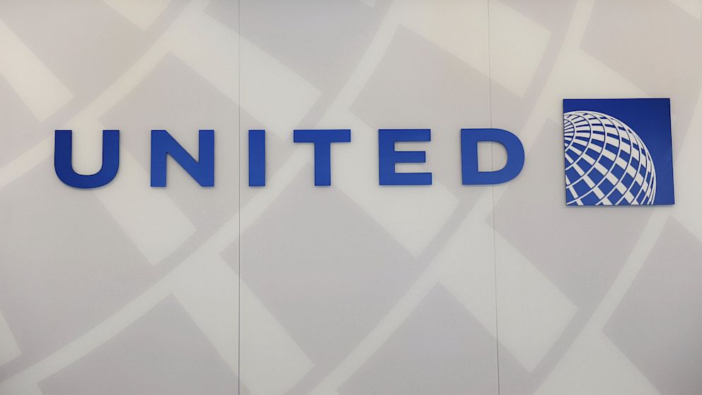 A United Airlines logo is seen behind the ticket counter at Chicago's O'Hare airport, Aug. 13, 2013.