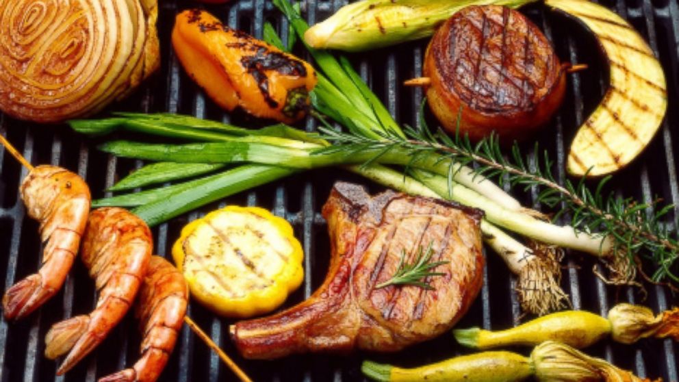 Grilled meats and vegetables are seen in on a grill in this undated file photo. 