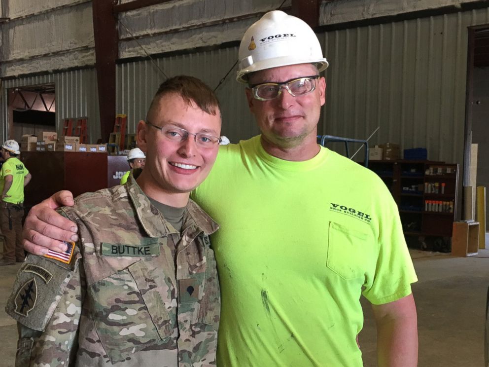 PHOTO: Twenty-one-year-old Tanner Buttke, left, surprised his dad, Scott Buttke, at Vogel Bros. Building Co. in DeForest, Wis., after returning home from deployment.