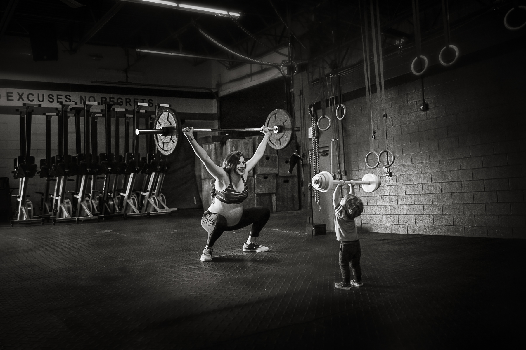 PHOTO: Her son imitates her lifting weights in the gym during Ferris' shoot.