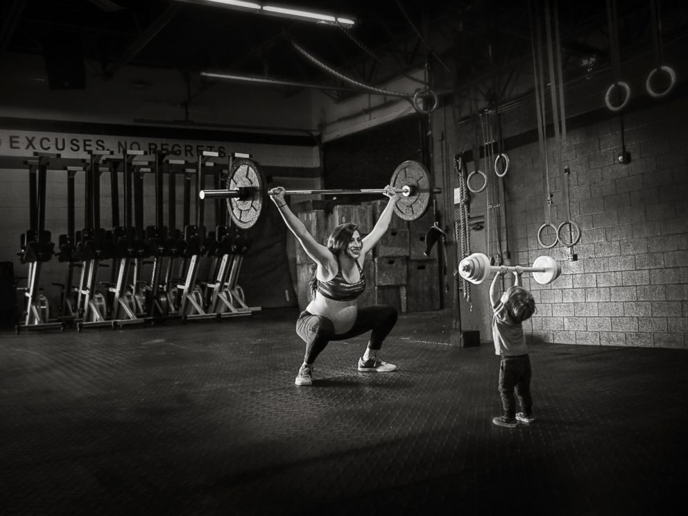 PHOTO: Her son imitates her lifting weights in the gym during Ferris shoot.