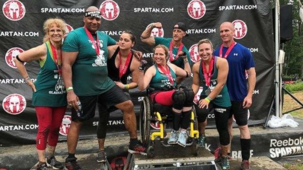 PHOTO: Tiffany Gambill, 27, who has Friedreich's ataxia, recently completed a Spartan Race in Rutland, Mass., with the help of teammates from her local CrossFit gym.