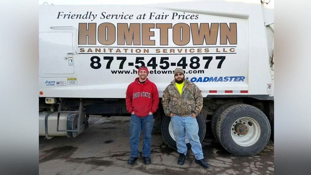 PHOTO: Brandon Olsen and Taylor Fritz of Hometown Sanitation Services seen in this photo on Dec. 29, 2016. 