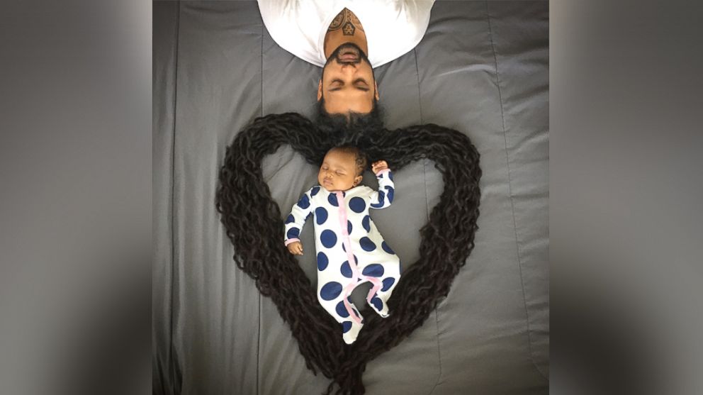 Photos of Ray Sookdial, of Miami, and his two-month-old daughter Arya have gone viral on Facebook.