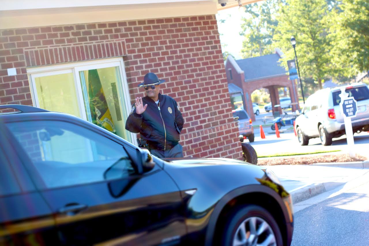 PHOTO: Jonathan Broadnax, the security guard at Mount Paran Christian School, was bombarded with hugs from students on the last day of school.