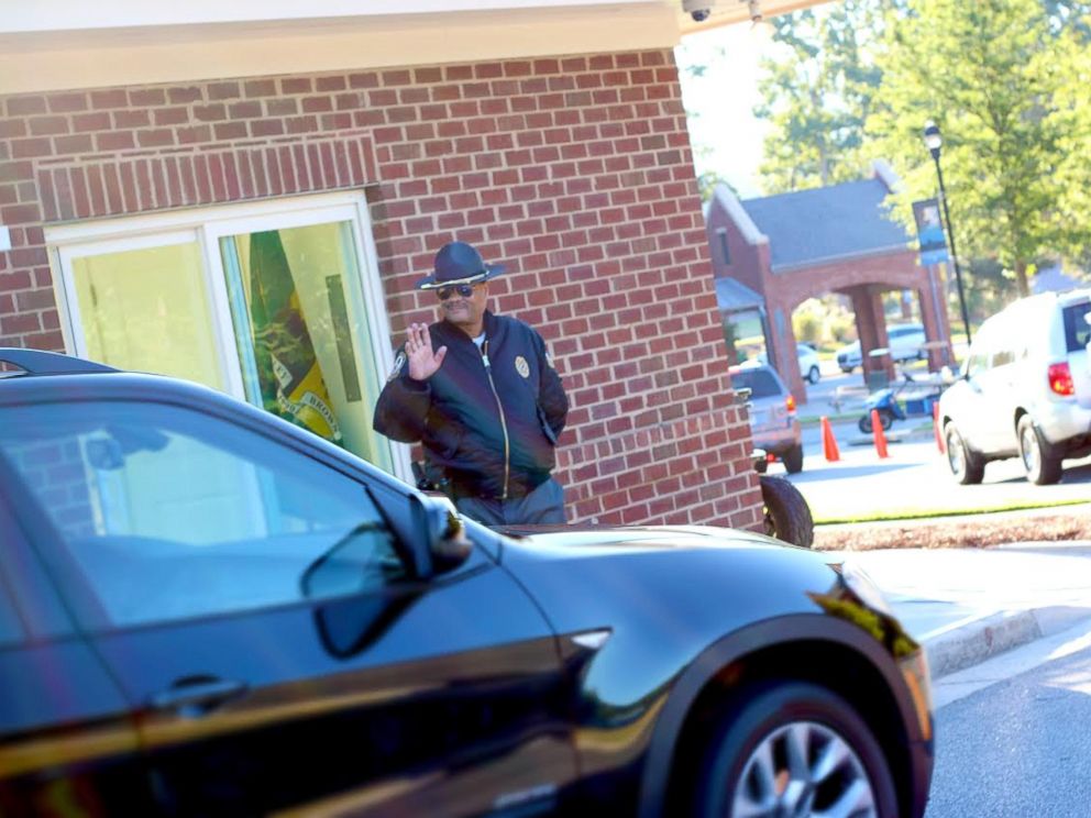 PHOTO: Jonathan Broadnax, the security guard at Mount Paran Christian School, was bombarded with hugs from students on the last day of school.