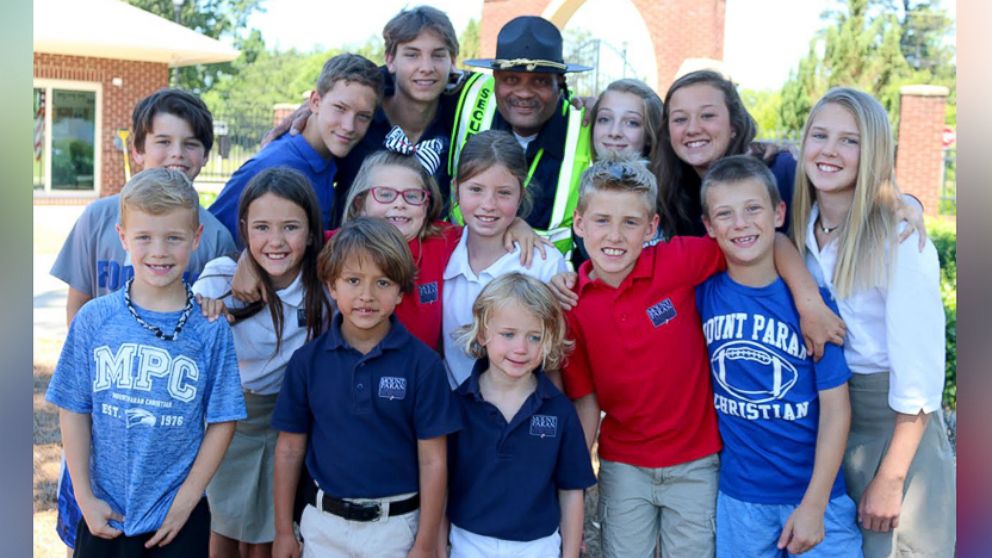 PHOTO: Jonathan Broadnax, the security guard at Mount Paran Christian School, was bombarded with hugs from students on the last day of school.