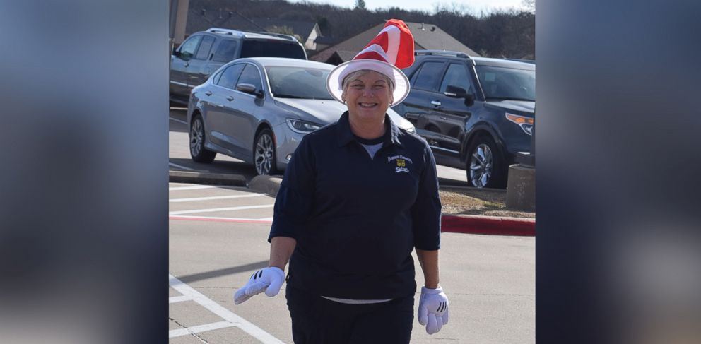 PHOTO: Cindy Matthews, a teacher's assistant at the Academy of the Arts at Bransom Elementary in Burleson, Texas, greets students in silly costumes every morning. Here she is shown wearing her Dr. Seuss hat. 