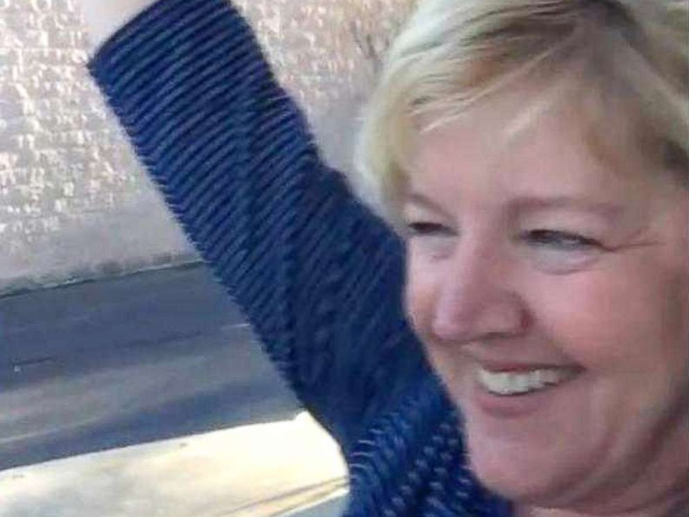 PHOTO: Michelle Ziner of Charlotte, North Carolina, reacts to her friend Tammy Waltz telling her the news that she and her husband Drew Waltz will be adopting four siblings from overseas.