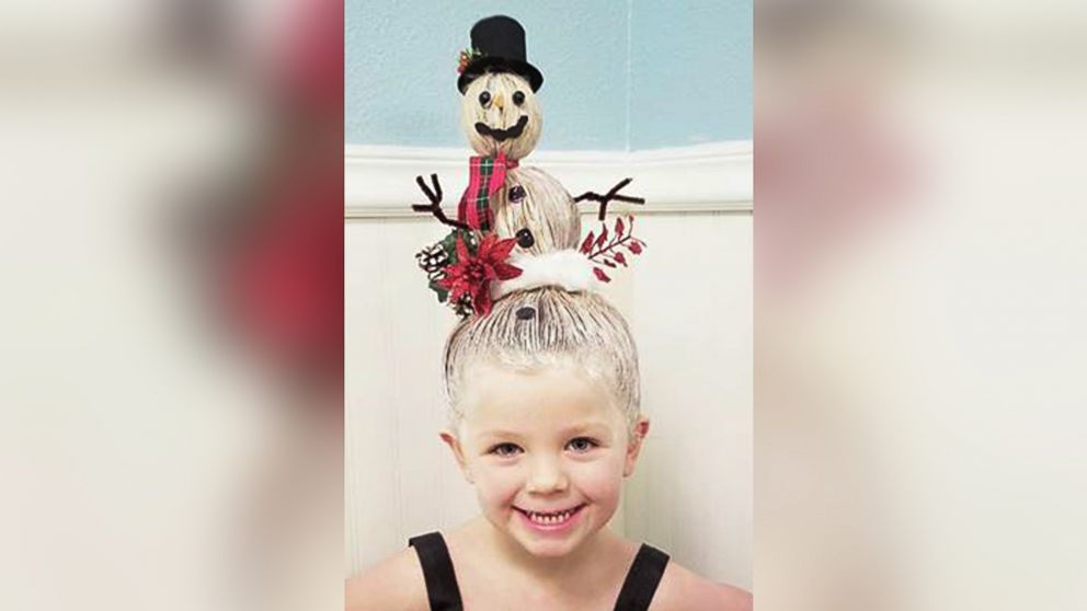 Greg Wickherst styles his daughter Izzy's hair for Christmas. This is the Snowman.