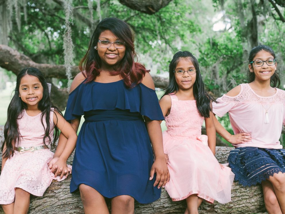 PHOTO: Josh and Jessaka Clark pose with their eight children in family photos taken in April 2017.