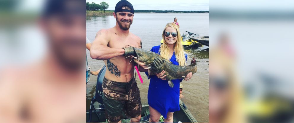 PHOTO: Shelby and Colt Moore of Mannford, Okla., learned they were having a baby girl with a catfish-noodling reveal party.