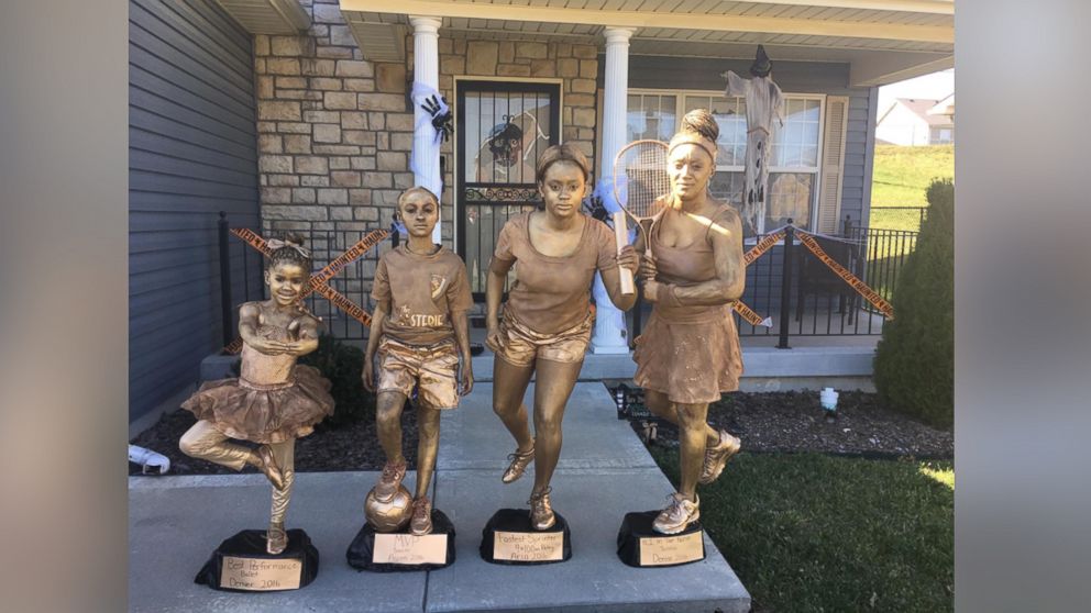 Denise Hill and her daughters, Denver, 5, Asten, 8, and Aria, 15, posed as trophies for Halloween.