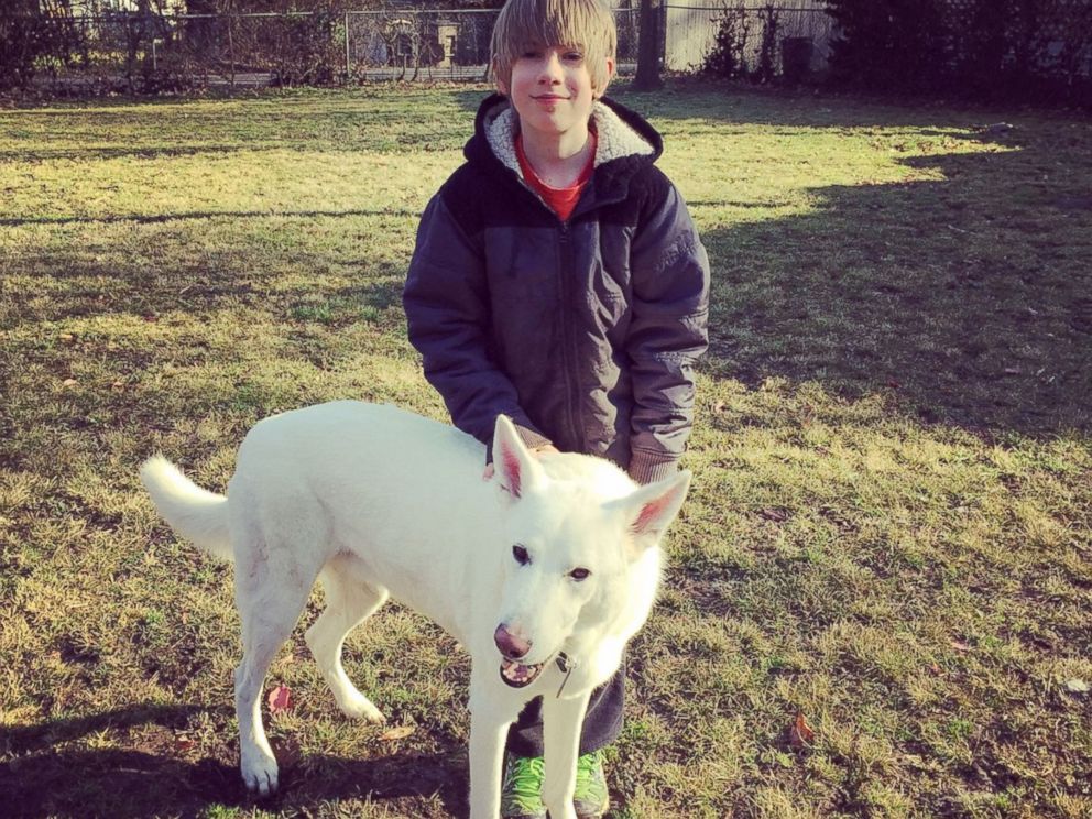 PHOTO: Lennox Goebel, 11, was overcome with tears as he was surprised with the return of his neighbors dog, Bogart, after spending a year in California.
