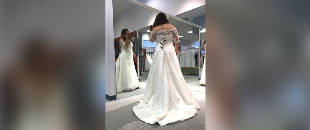 PHOTO: Amber McGraw poses in the wedding gown she chose at an Alfred Angelo store. 