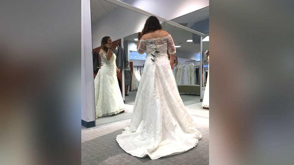 PHOTO: Amber McGraw poses in the wedding gown she chose at an Alfred Angelo store. 