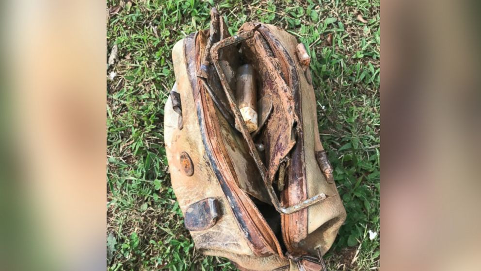 Woman s purse lost in lake found by boy while fishing 25 years