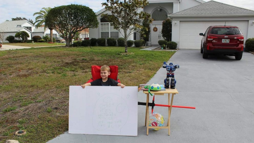 Little boy, Blake Work, paid it forward by holding a "free toy" stand for children who are less fortunate. 