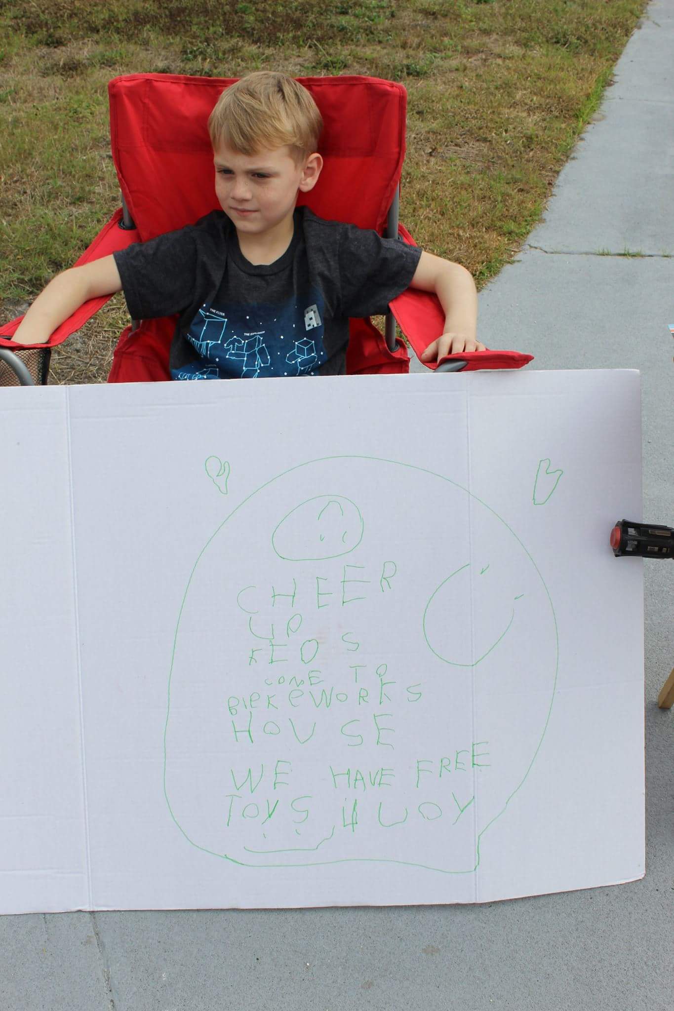 PHOTO: Little boy, Blake Work, paid it forward by holding a "free toy" stand for children who are less fortunate. 