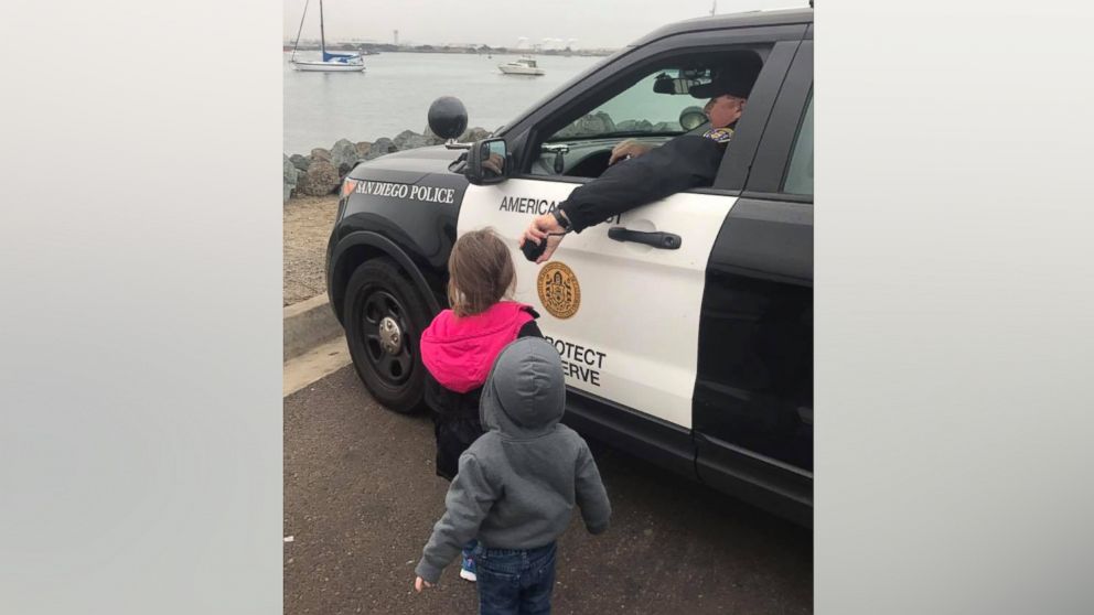 Officer James Weaver of the San Diego Police Department allowed Rileigh, 4, and Austin Buetow, 2, to bid farewell to their dad over his patrol car public-address system as he was about to leave on a ship for deployment from Shelter Island on Jan. 5.