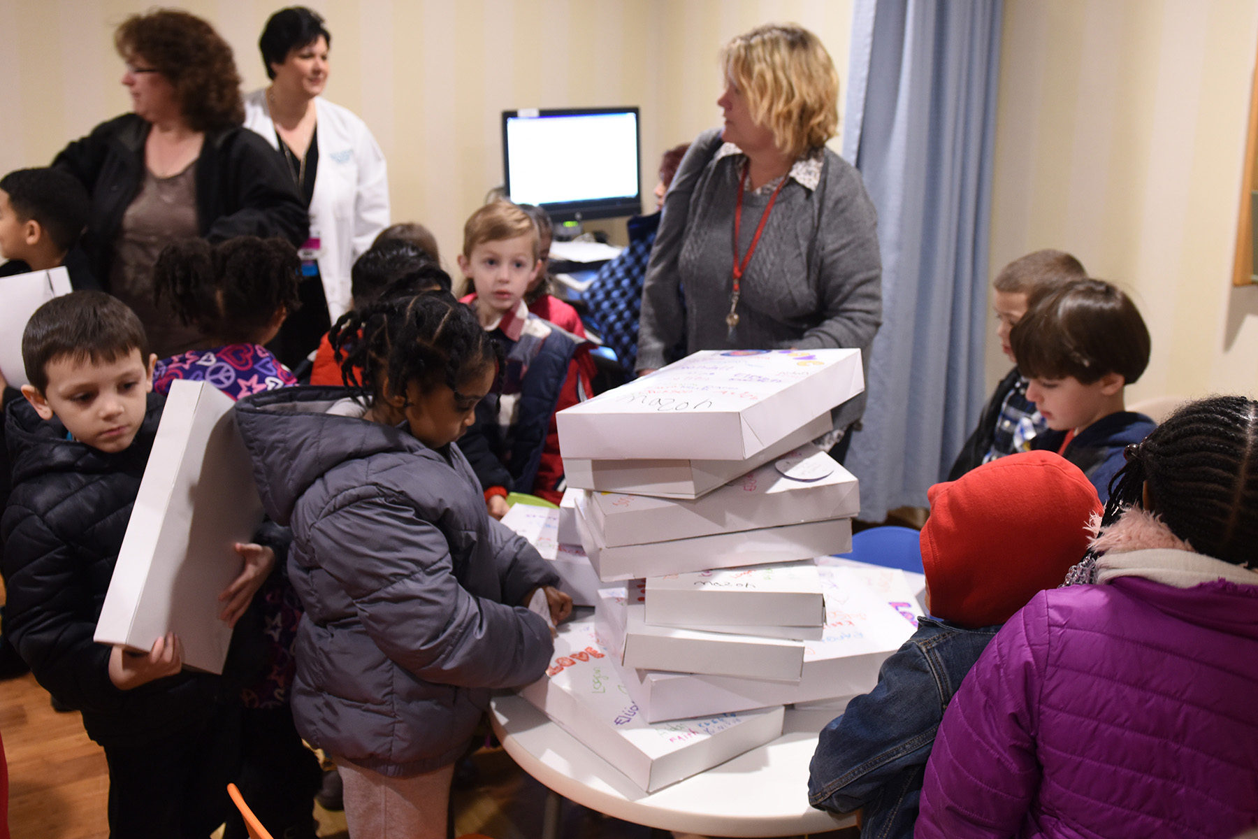 PHOTO: Teacher Gretchen Hertler McInvale and her students deliver boxes containing baby necessities to Saint Francis Hospital and Medical Center in Hartford, Connecticut in February each year. 
