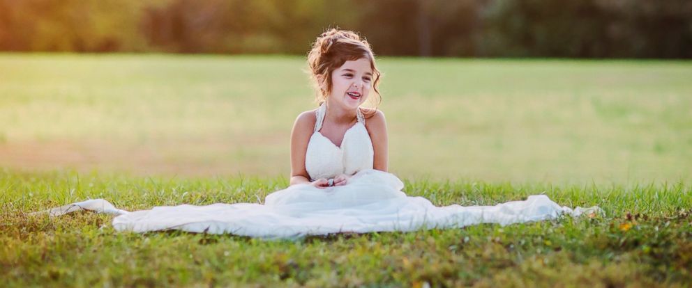 daughter in mom's wedding dress