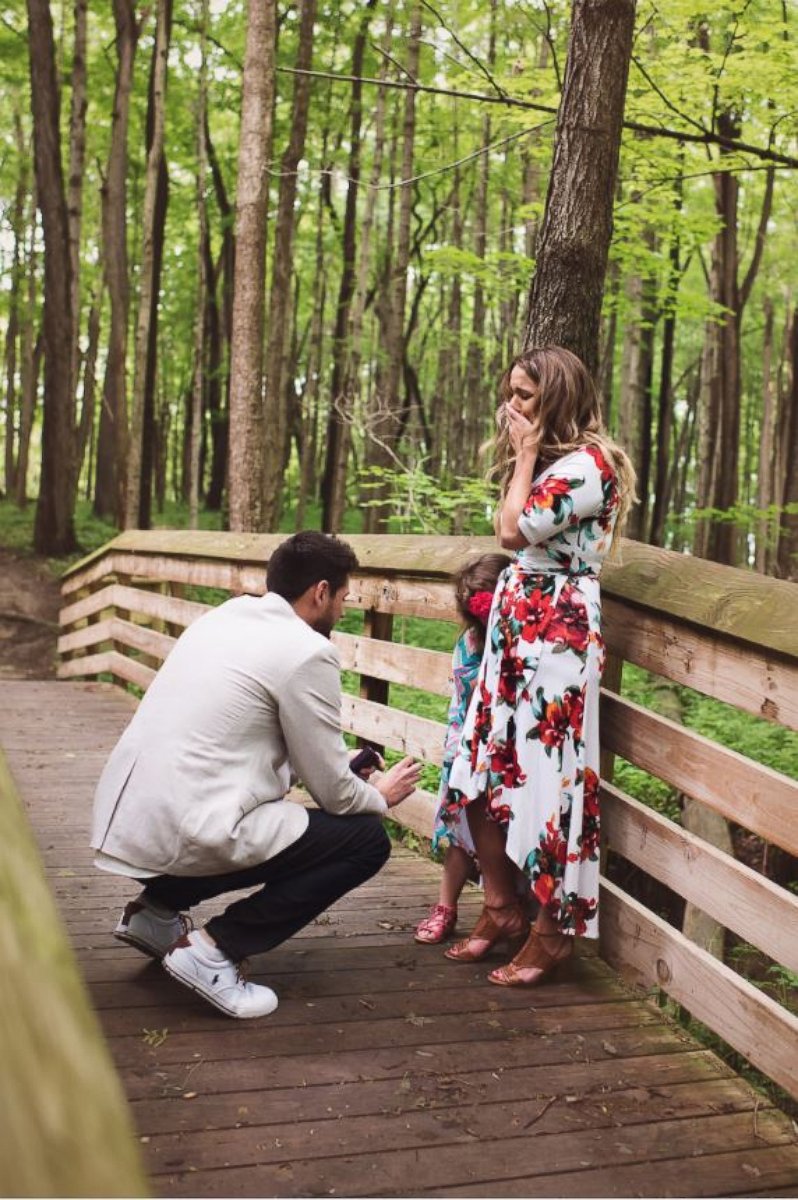 PHOTO: Grant Tribbett proposes to his girlfriend Cassandra Reschar and her 5-year-old daughter, Adrianna, on May 27, 2017.