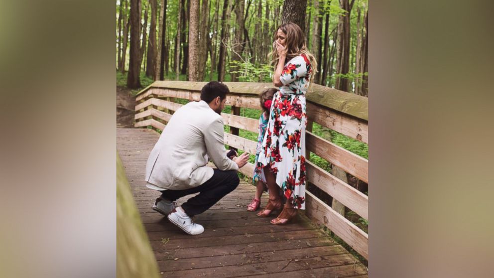 PHOTO: Grant Tribbett proposes to his girlfriend Cassandra Reschar and her 5-year-old daughter, Adrianna, on May 27, 2017.