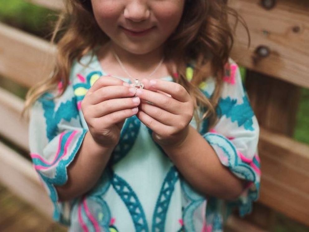 PHOTO: Grant Tribbett proposes to his girlfriend Cassandra Reschar and her 5-year-old daughter, Adrianna, on May 27, 2017.