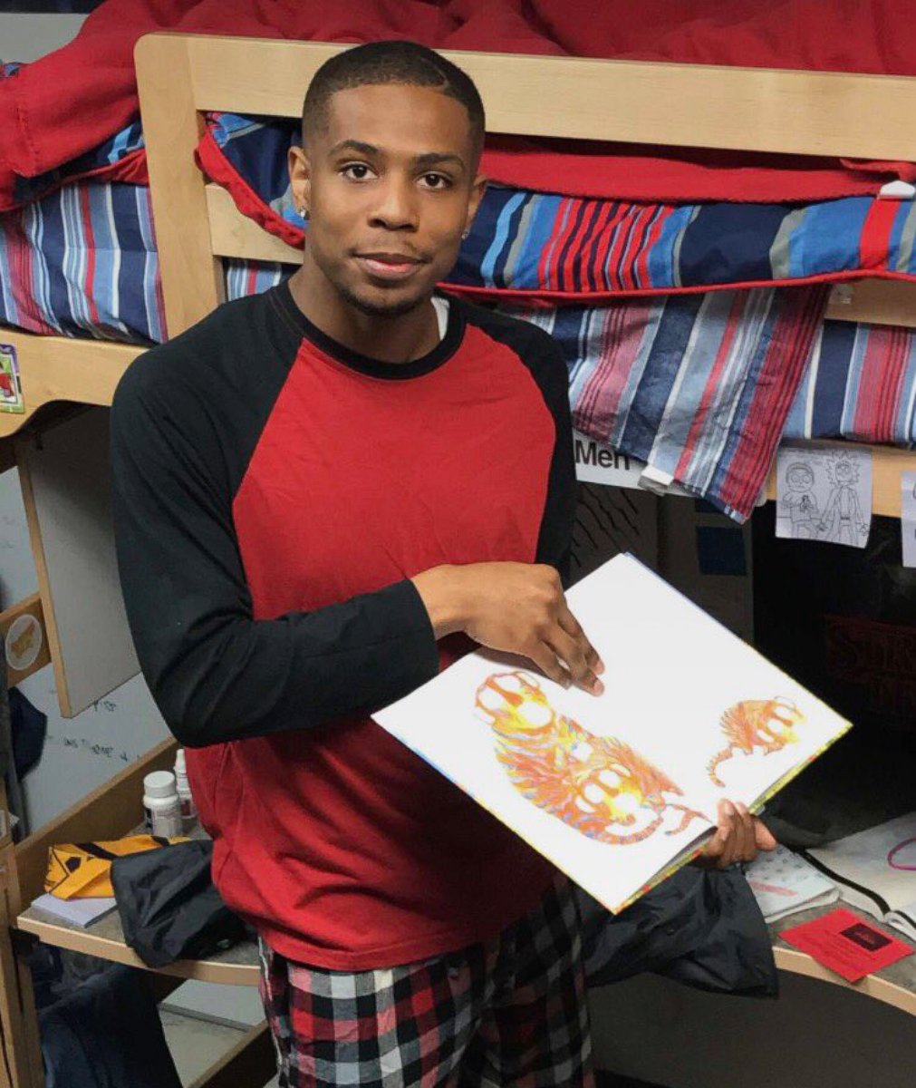 PHOTO: After University of Tennessee resident assistant Quamir Boddie asked his students what they needed to feel at home, he fulfilled Andrew Kochamba's request of reading him a bedtime story.