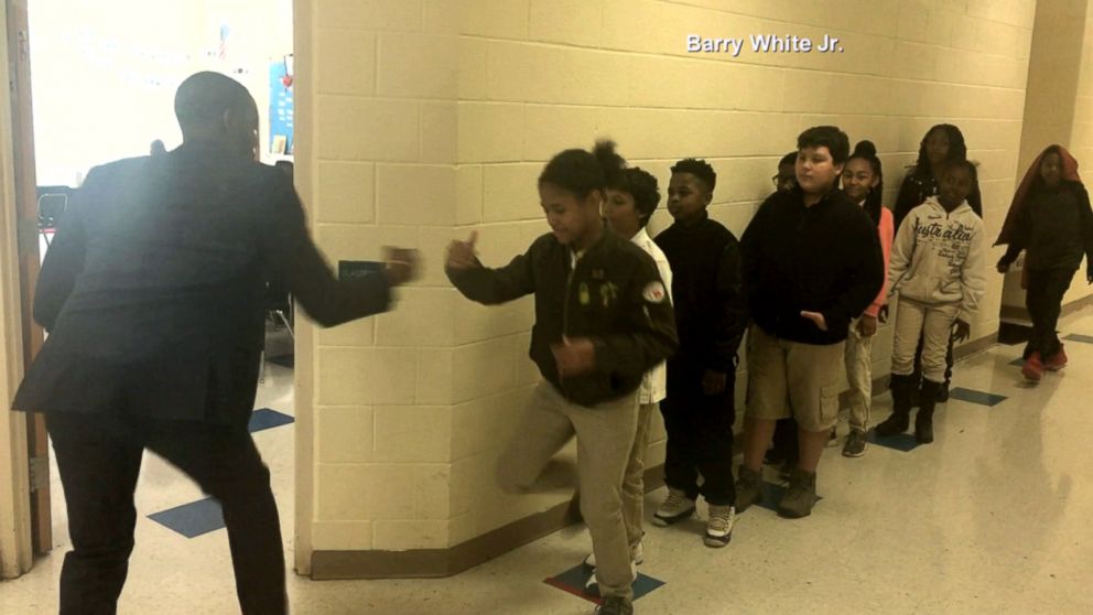 PHOTO: Barry White, Jr., a fifth grade teacher in Charlotte, North Carolina, personally shakes hands with every single one of his students. 