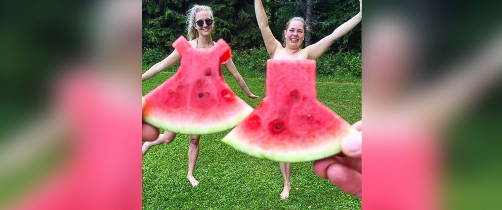 PHOTO: Two friends playfully pose in their watermelon dresses.