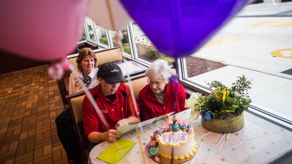 PHOTO: Nadine Baum reads a birthday card with McDonald's employee Kim Birgensmith and manager Sandy Arentz, background, Oct. 13, 2016 at the south Hanover McDonald's.