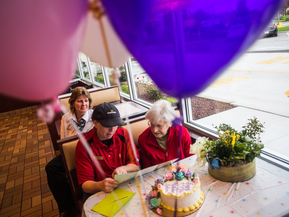 PHOTO: Nadine Baum reads a birthday card with McDonalds employee Kim Birgensmith and manager Sandy Arentz, background, Oct. 13, 2016 at the south Hanover McDonalds.