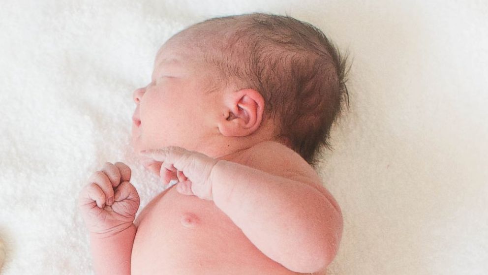Photographing babies with their placenta still attached is a growing trend among new moms. 