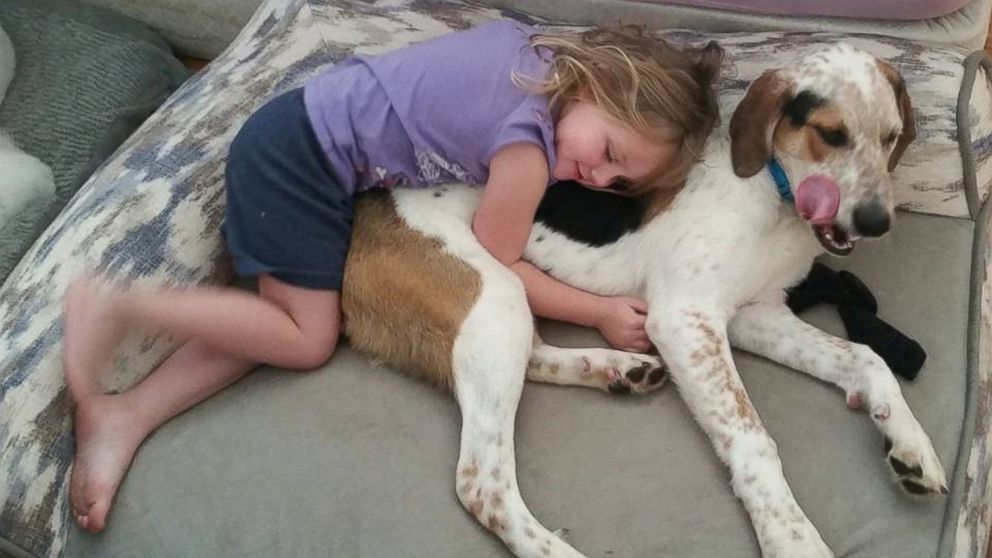 Neeva, 4, is deaf and uses sign language to communicate with her dog, Baxter. 